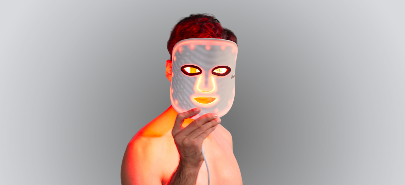 Man wearing a Hard LED light mask