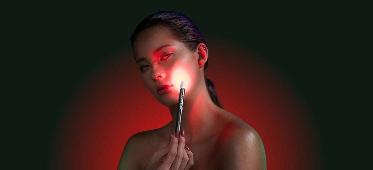 Woman using Glotech™ Acne Wand